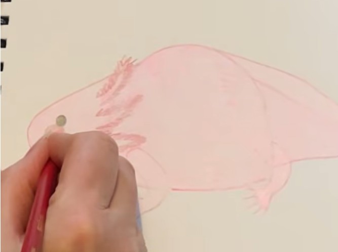 Designer sketching the early structure of a TeaCosyFolk character during the concept stage