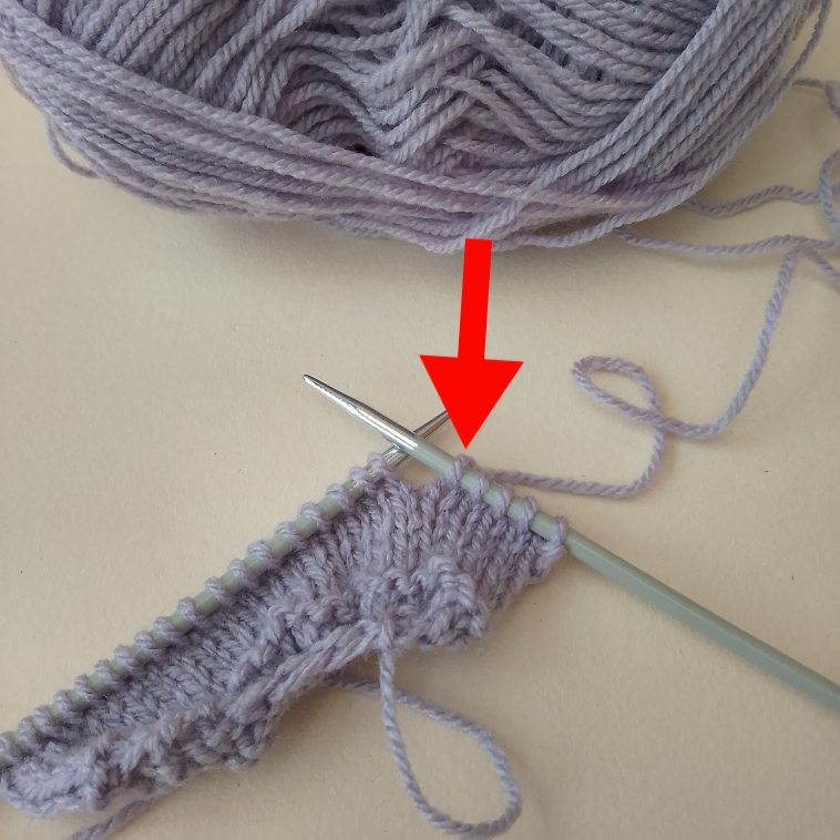Last stitch worked is sitting on the right‑hand needle, showing that the next row to knit is a right‑side row.