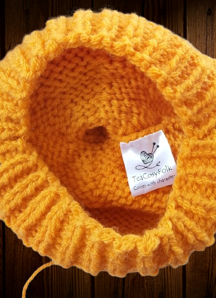 Knitted structural engineering is the best way to sew head onto tea cosy