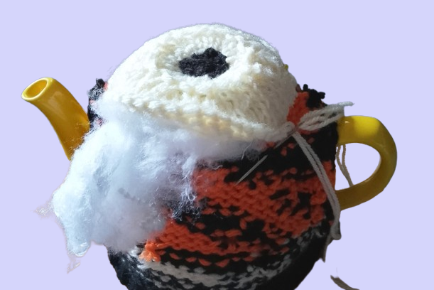 Creative craft process, making a tiger tea cosy